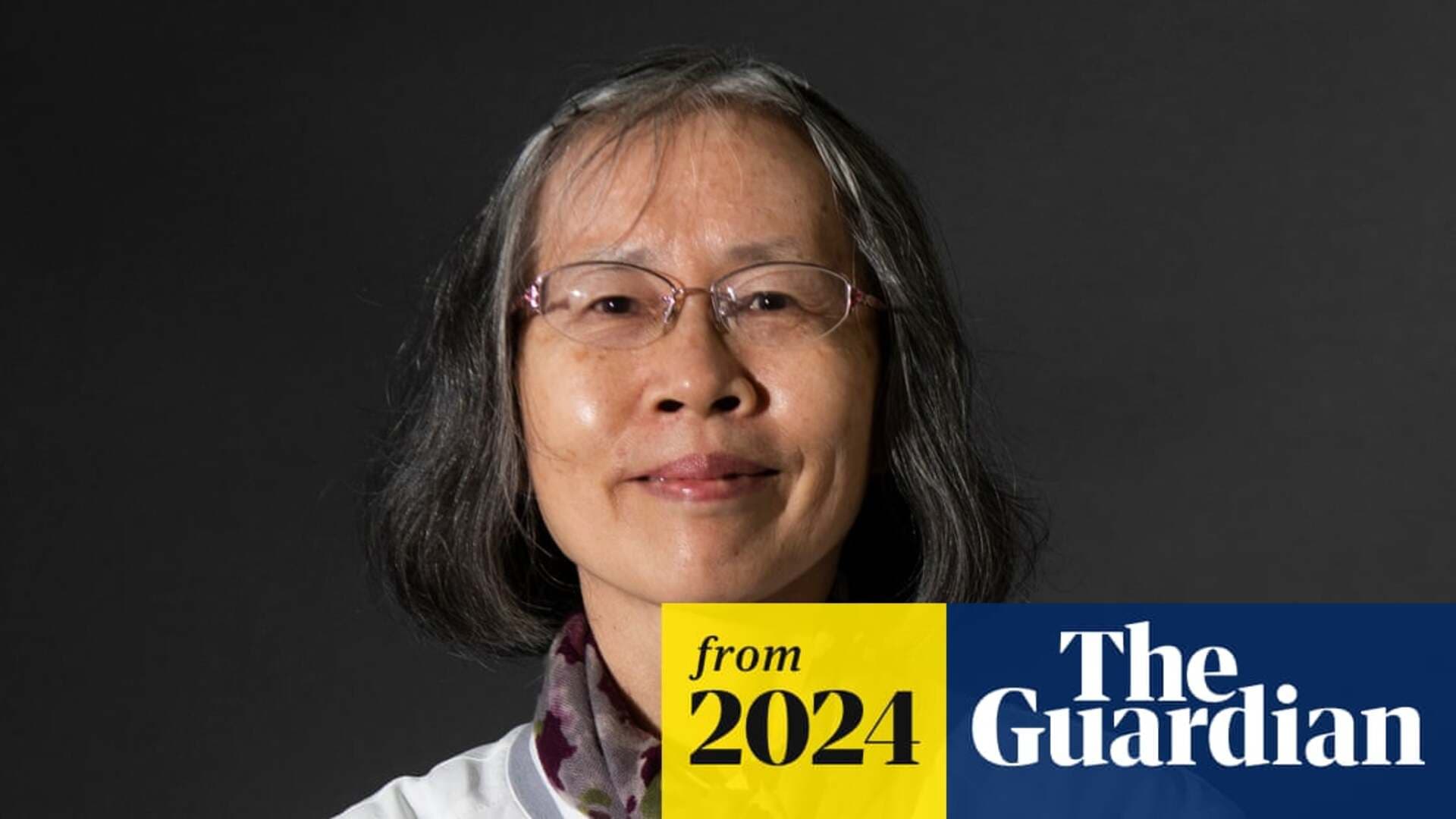 Can Xue standing in front of a bookshelf ahead of the 2025 Nobel announcement
