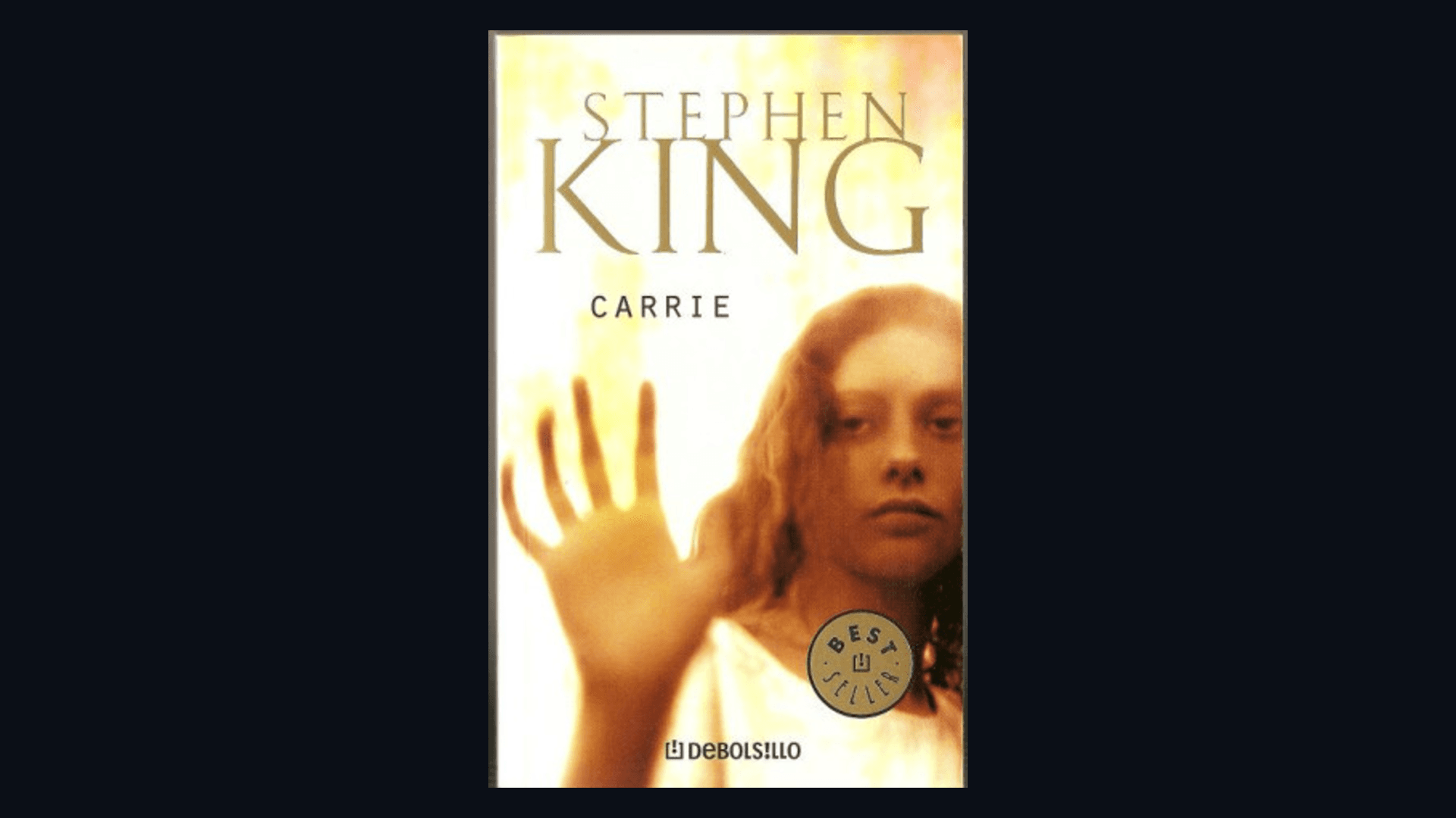 Cover of Carrie by Stephen King framed on a dark background