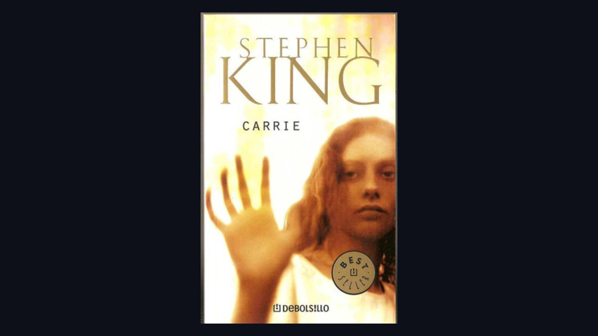 Cover of Carrie by Stephen King framed on a dark background