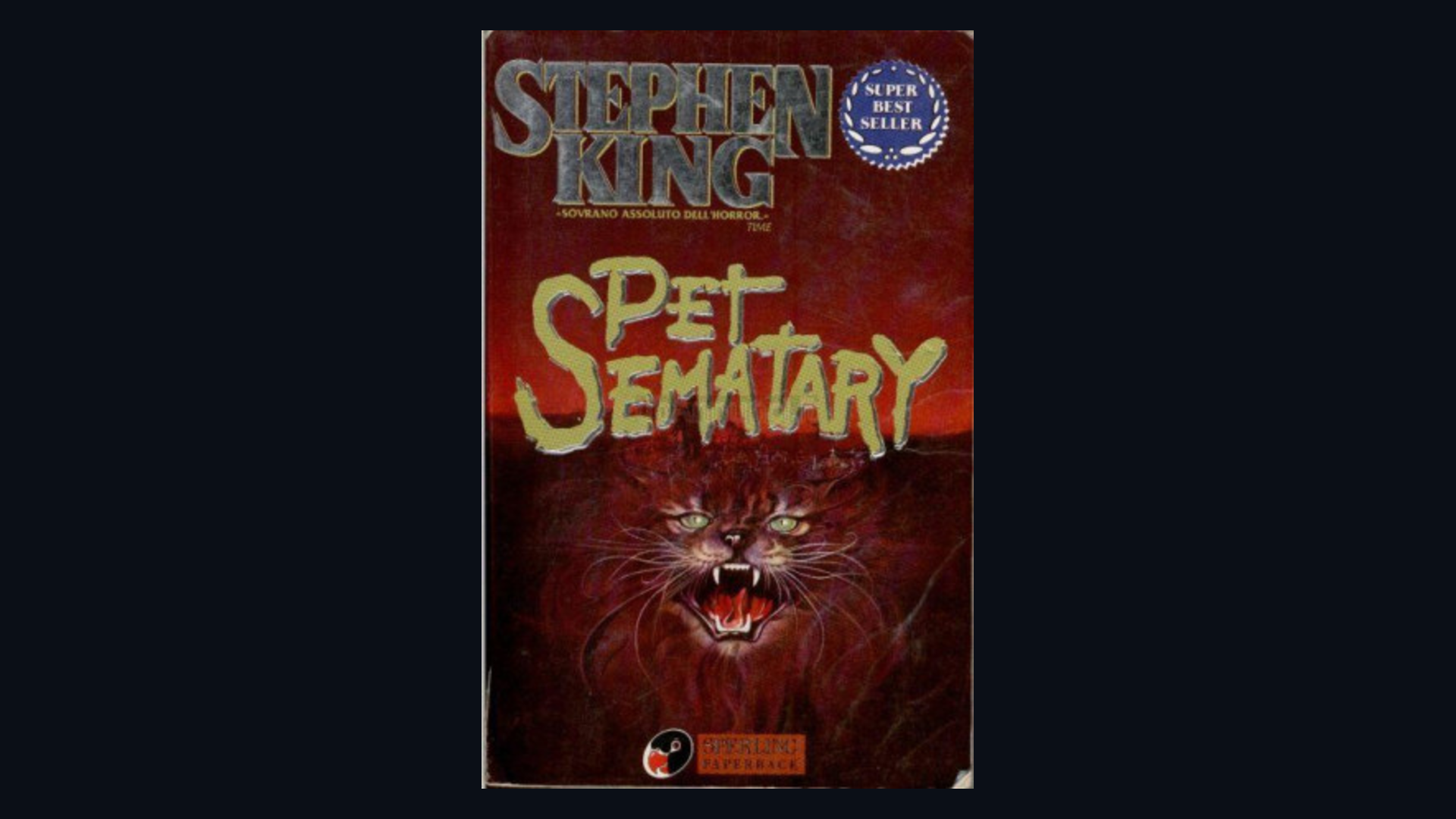 Cover of Pet Sematary by Stephen King framed on a dark background