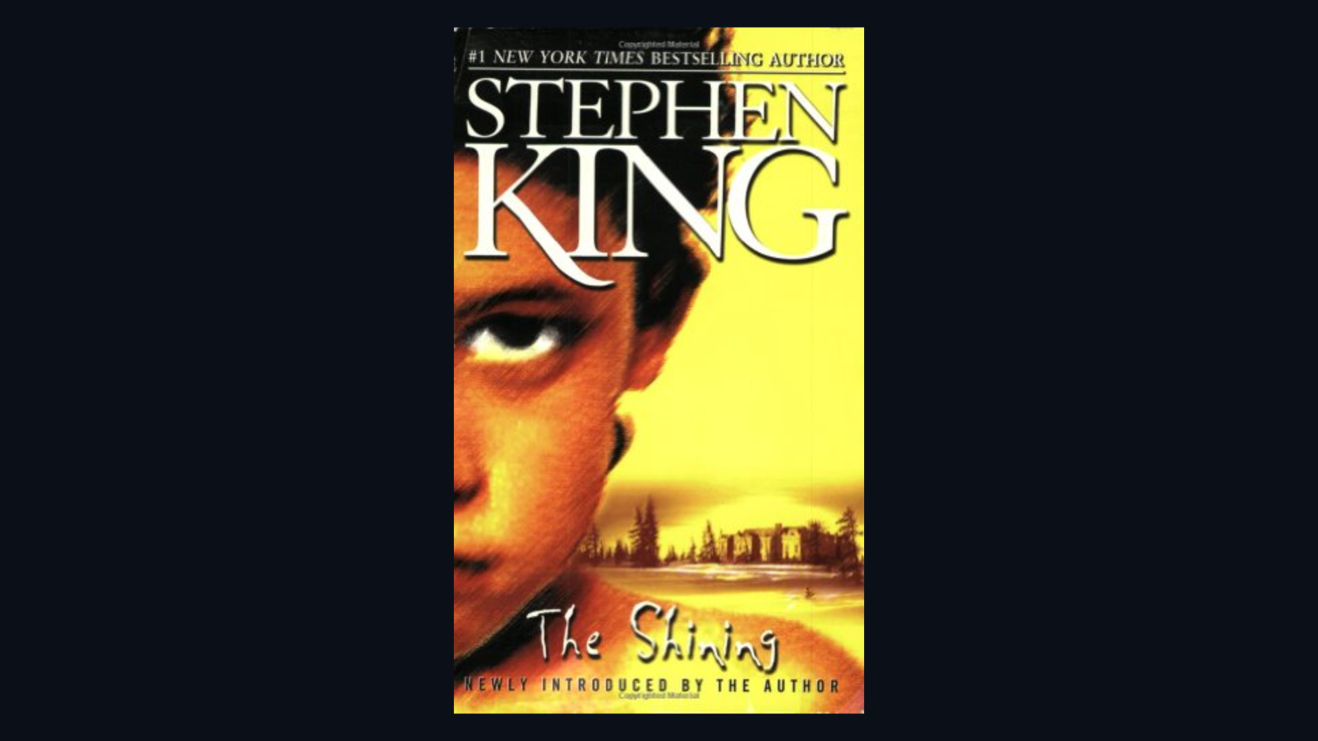 Cover of The Shining by Stephen King framed on a dark background